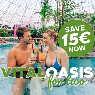 A couple is sitting with cocktails in the pool.