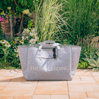 Gray beach bag made of felt and cotton with white “Therme Erding” lettering 