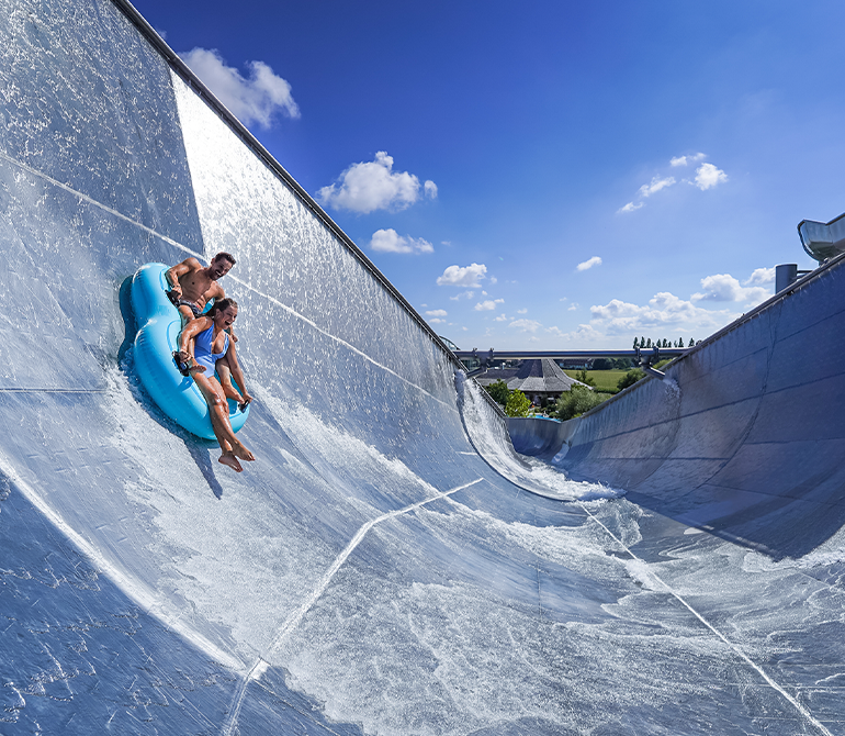Couple in the water halfpipe of the Big Wave tire slide.