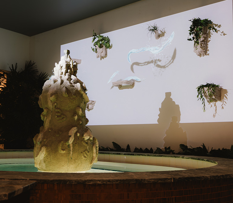 Water basin with Flying Waters artwork on the wall