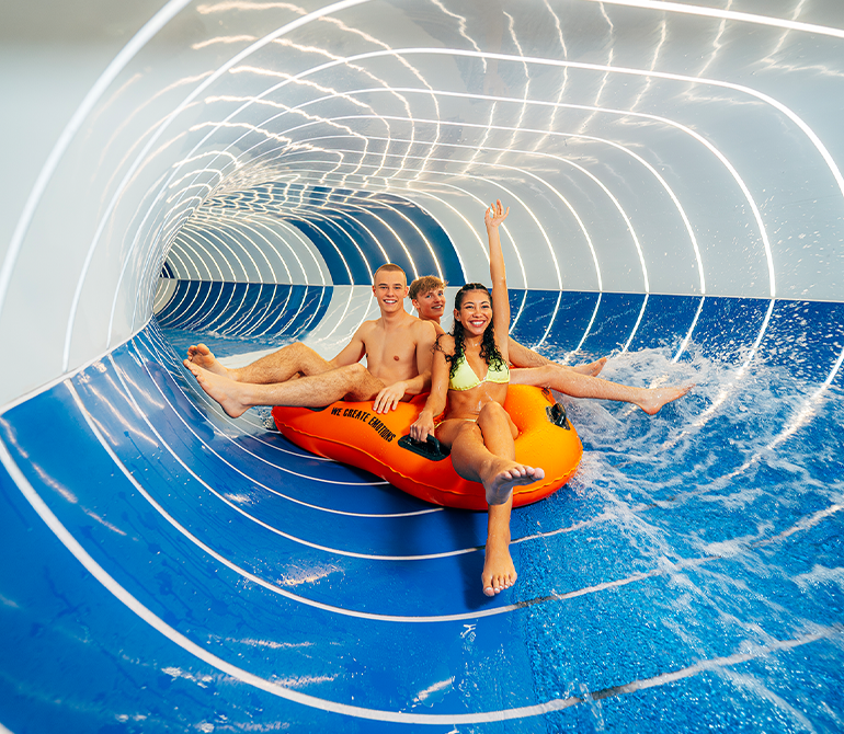 Friends on a 3-person tube in the Magic Eye tube slide.